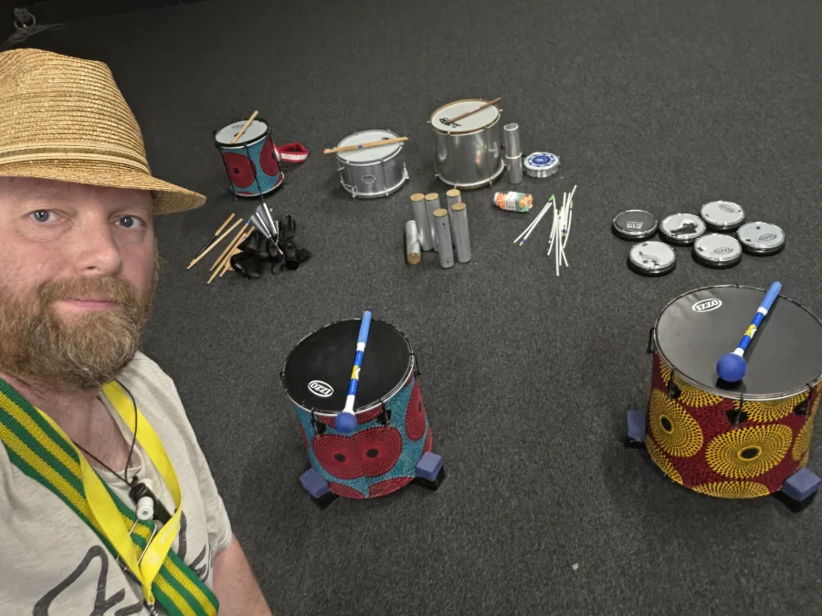 Soul Tonic lead instructor Dave Holmes in a room with percussion instruments